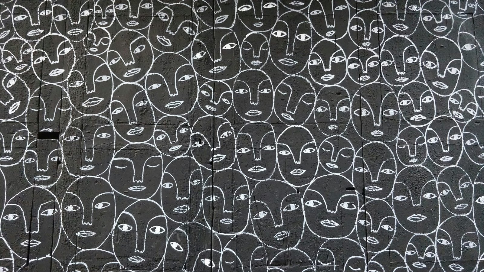 abstract black and white image of many faces